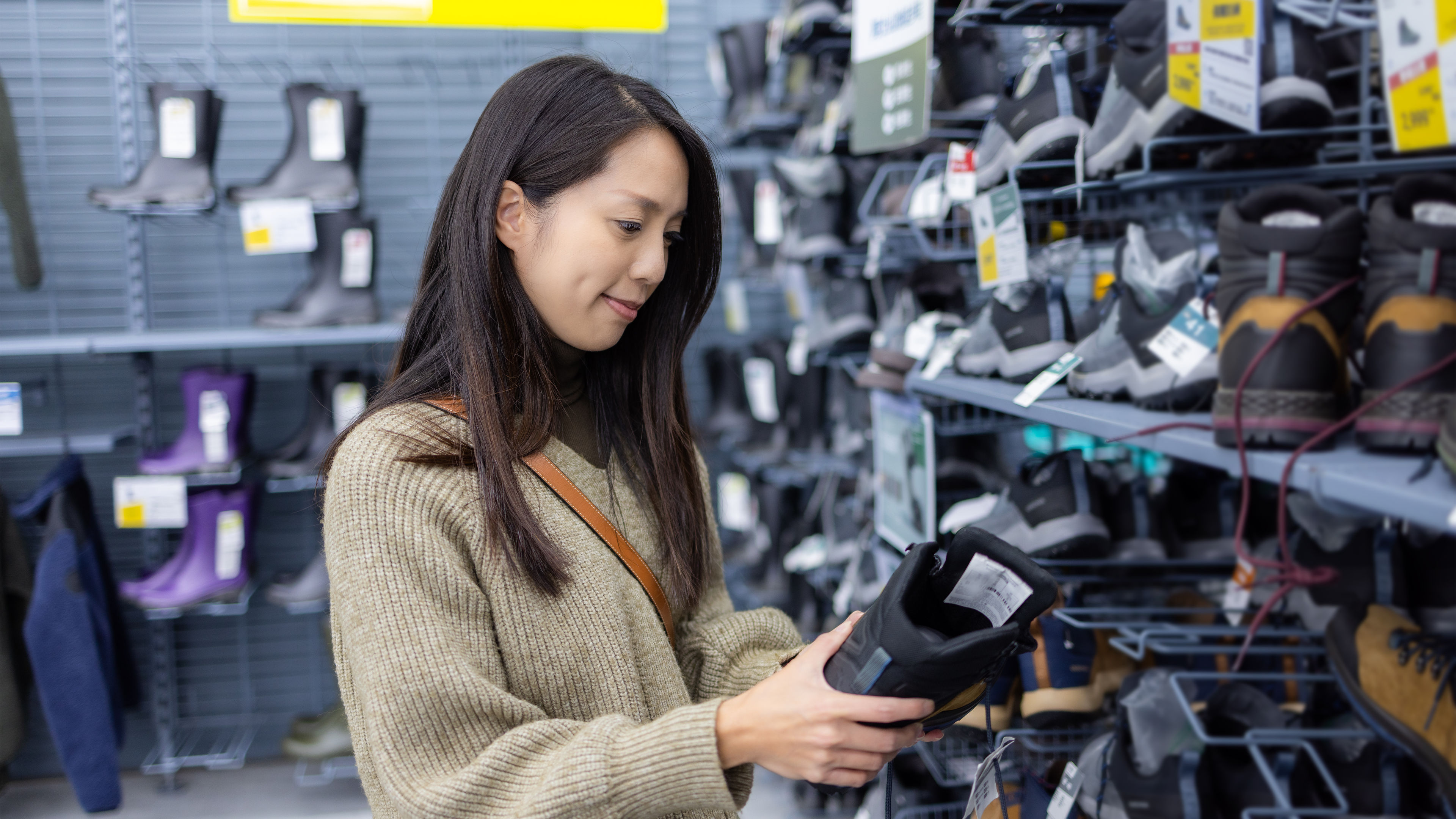 A woman holding a shoe