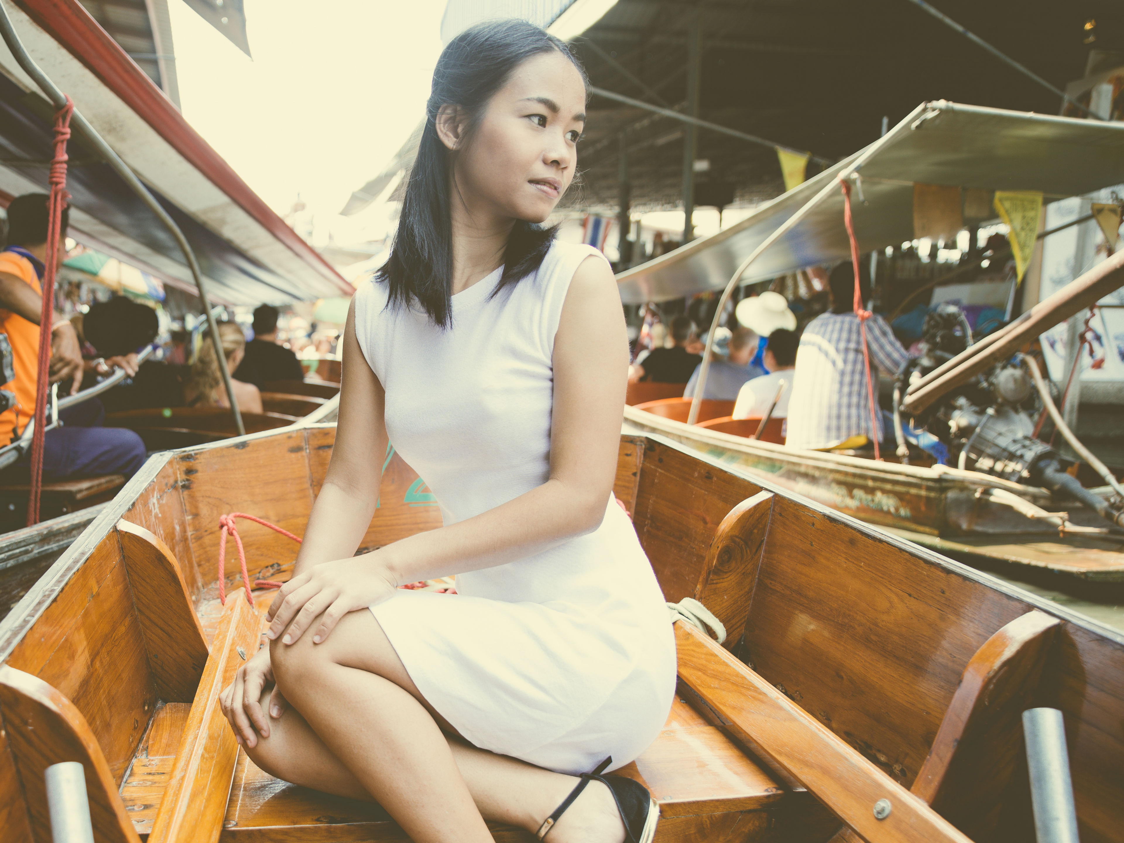 A woman in the floating market .