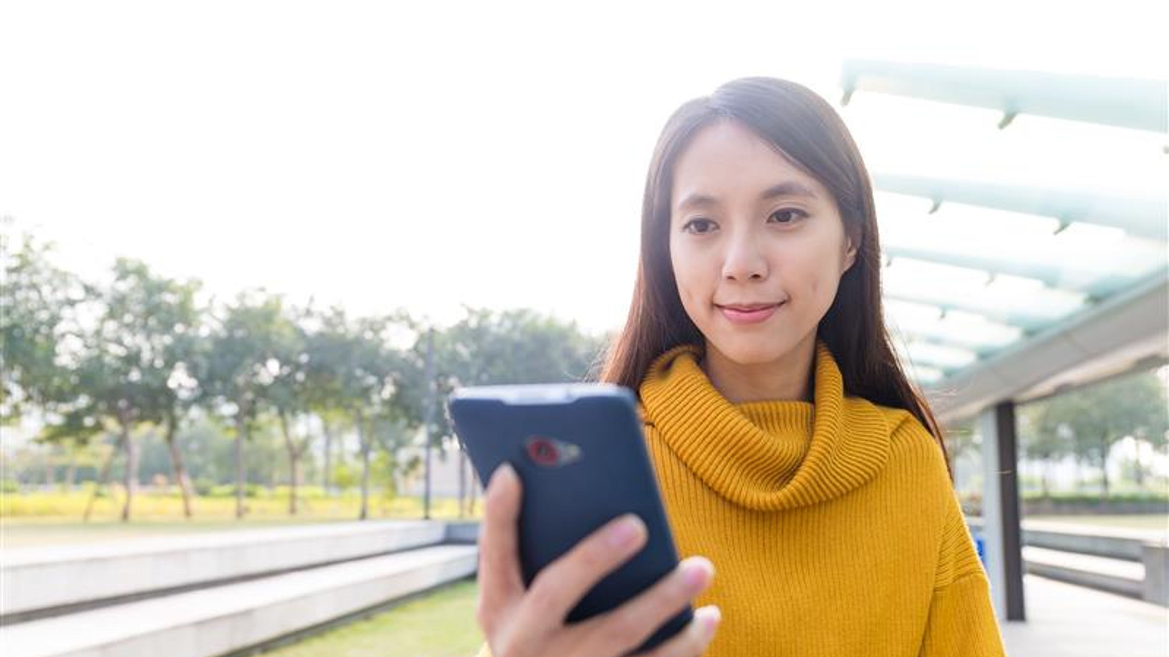 Asian Young Woman use of the cellphone