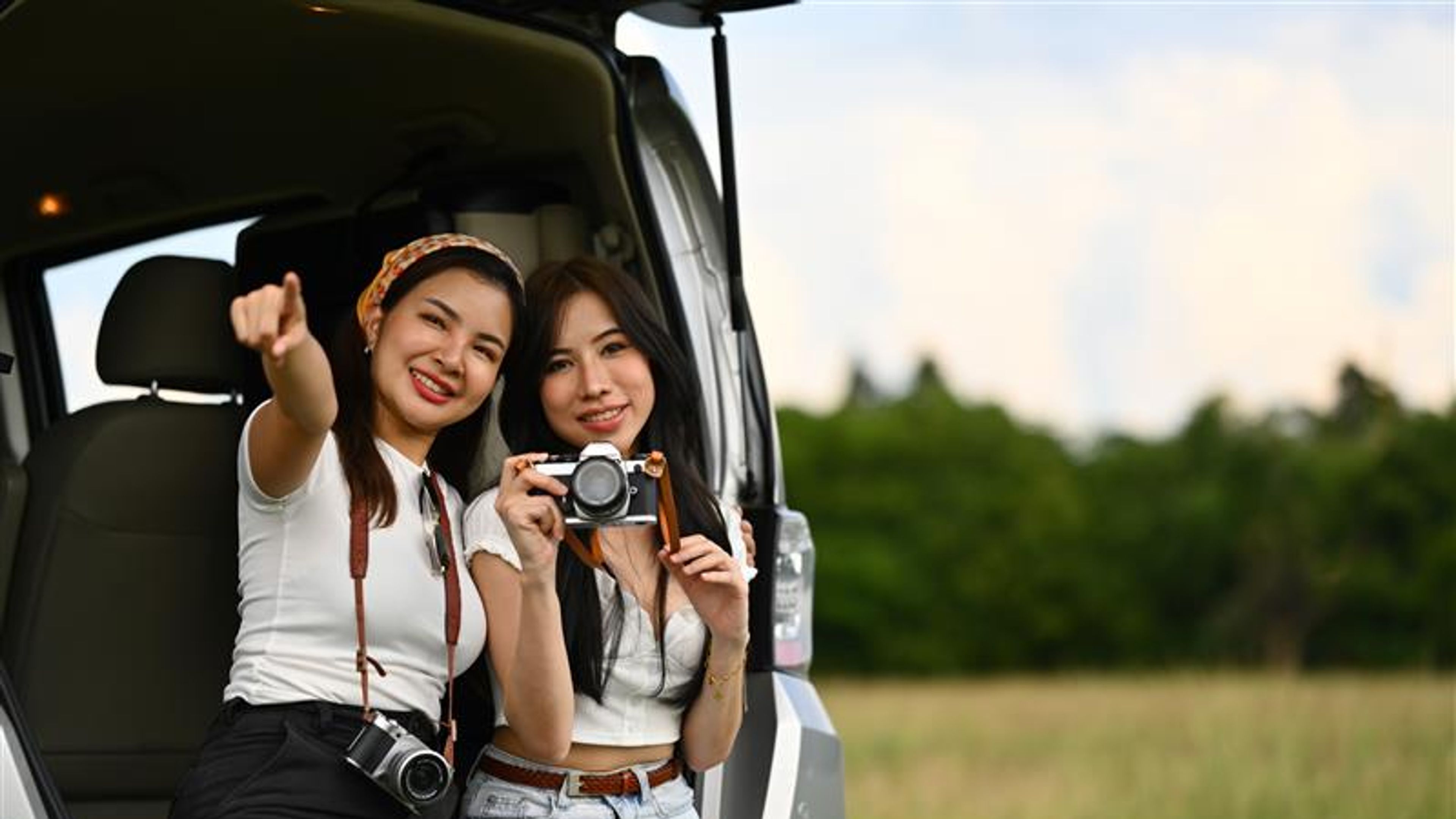Two women with a camera in hand